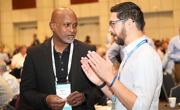 two men talking about their lean construction group